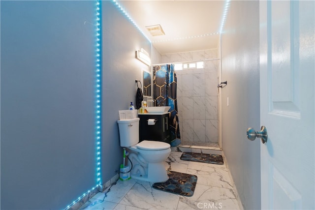 bathroom featuring walk in shower, vanity, and toilet