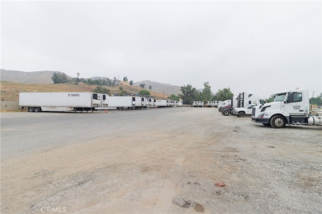 view of parking with a mountain view