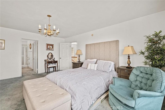 bedroom featuring connected bathroom, carpet, and a notable chandelier