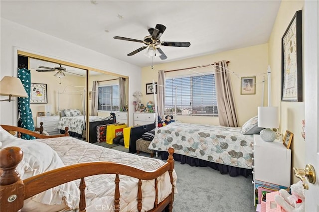 carpeted bedroom with ceiling fan and a closet