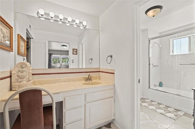 bathroom featuring vanity, tile patterned floors, a wealth of natural light, and bath / shower combo with glass door