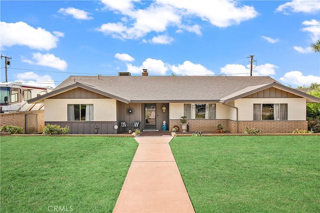 single story home with a front yard