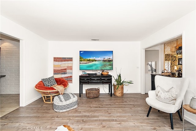 living area featuring hardwood / wood-style floors