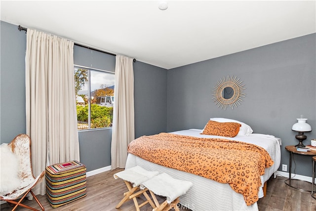 bedroom with hardwood / wood-style floors