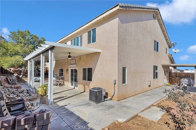 back of house with a patio, ceiling fan, and cooling unit