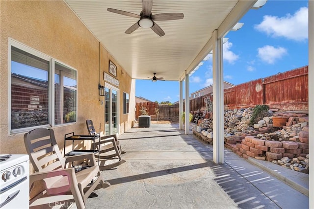 view of patio / terrace featuring ceiling fan and cooling unit