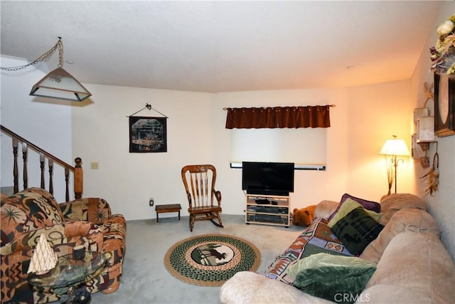 living room with stairs and carpet floors