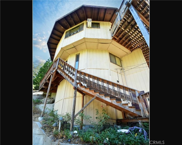 view of property exterior with stairs