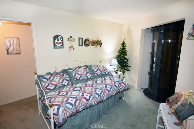 bedroom with carpet and a closet