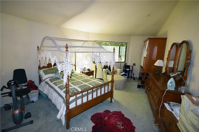 carpeted bedroom featuring vaulted ceiling