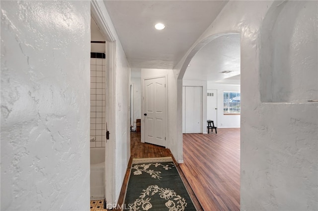 hallway featuring dark wood-type flooring