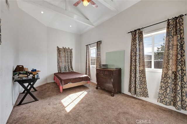 carpeted bedroom with vaulted ceiling with beams and ceiling fan