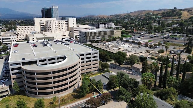 property's view of city featuring a mountain view