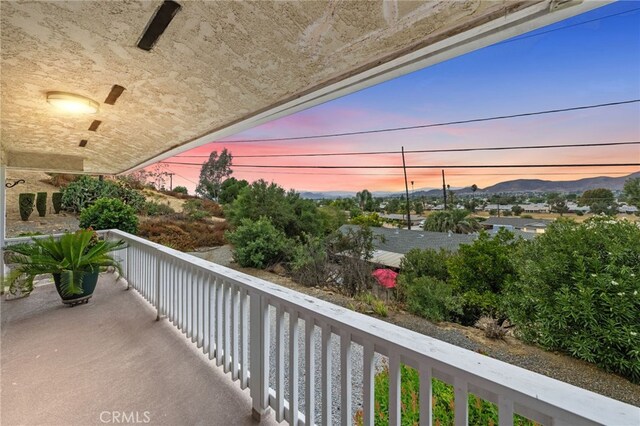 balcony at dusk with a mountain view