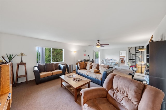 living room featuring ceiling fan and carpet flooring