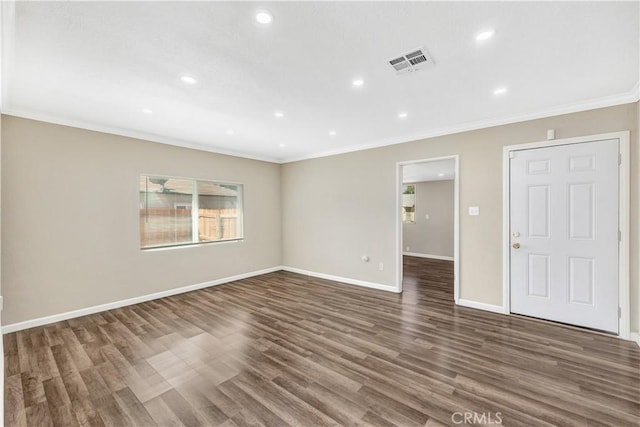 unfurnished room with dark hardwood / wood-style floors and crown molding