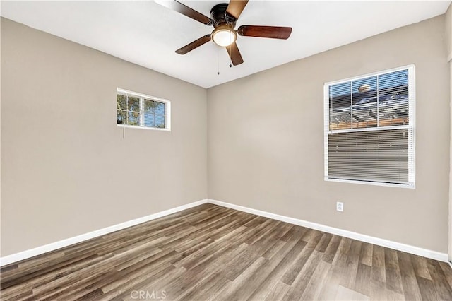 spare room with ceiling fan and hardwood / wood-style floors