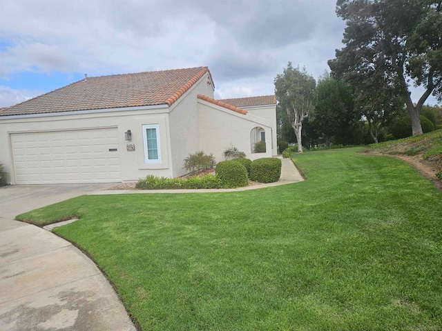 view of home's exterior with a yard and a garage