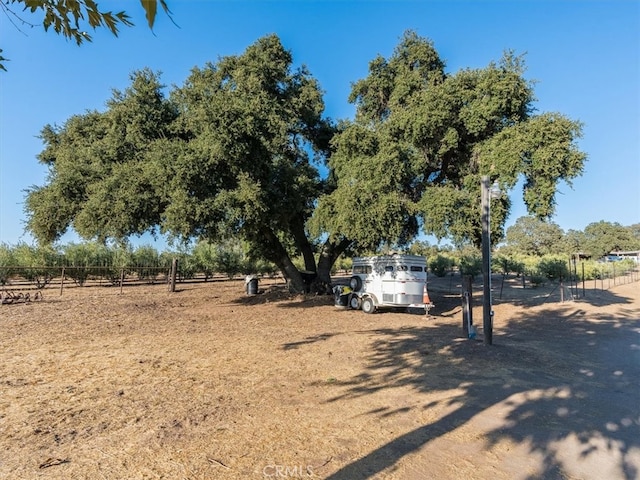 view of yard with a rural view