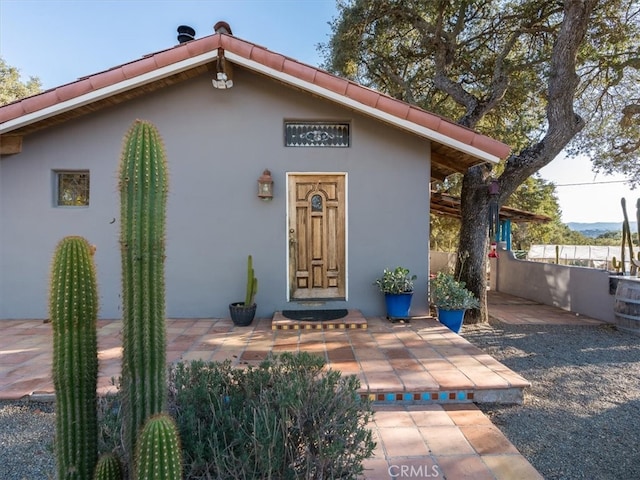 property entrance with a patio area