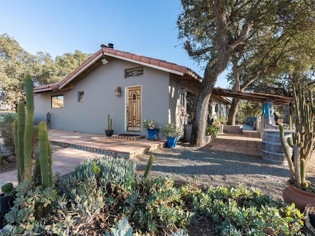 back of house with a patio