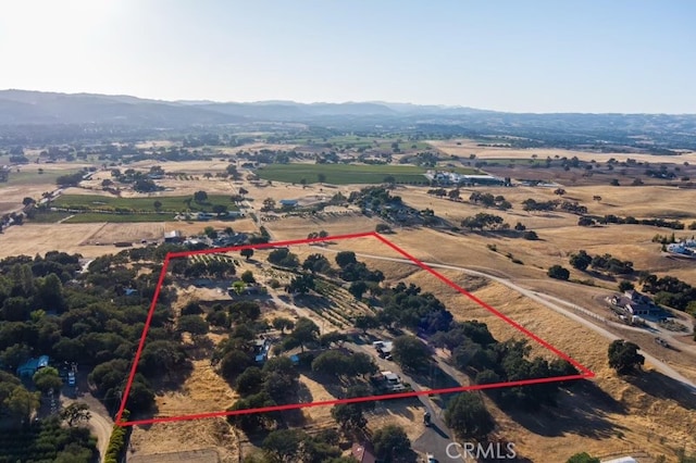 birds eye view of property with a rural view and a mountain view