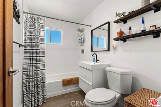 full bathroom featuring shower / tub combo, vanity, and toilet