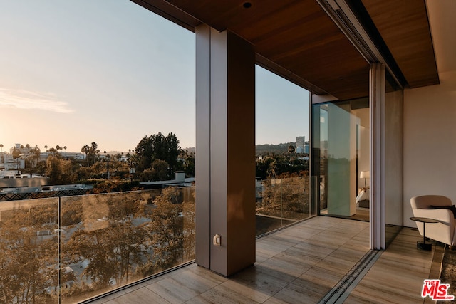 view of balcony at dusk