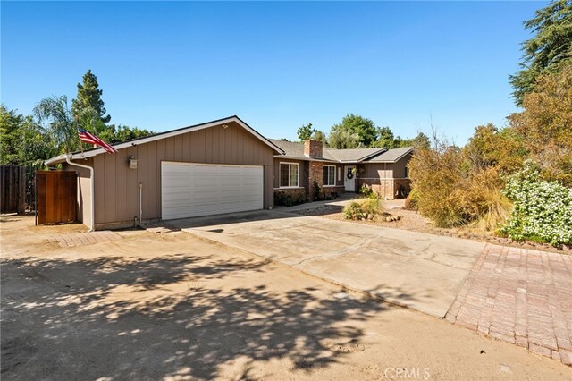 ranch-style house featuring a garage