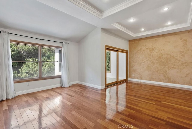 unfurnished room with wood-type flooring and crown molding