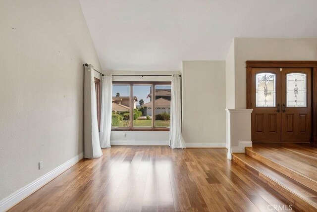 entrance foyer featuring wood-type flooring and french doors