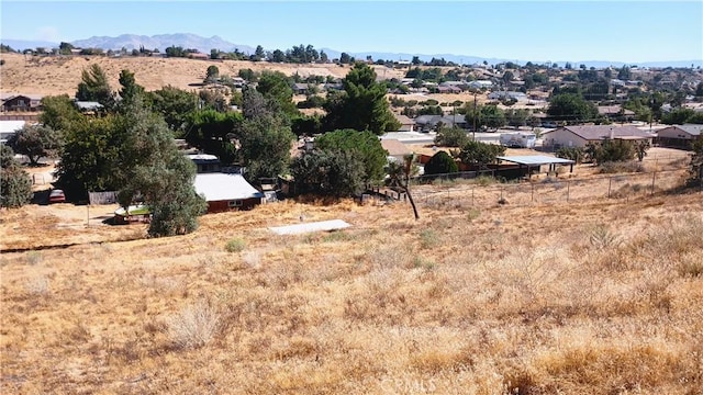 birds eye view of property with a mountain view