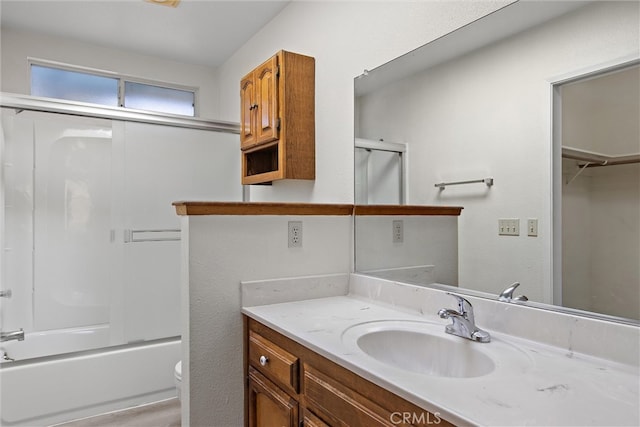 full bathroom with vanity, toilet, and combined bath / shower with glass door