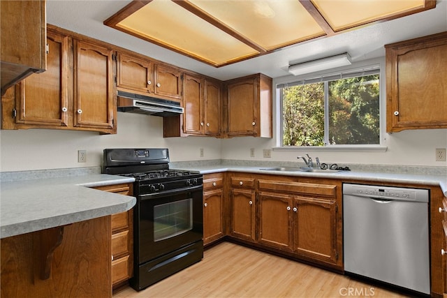 kitchen with sink, light hardwood / wood-style flooring, dishwasher, and black gas range oven