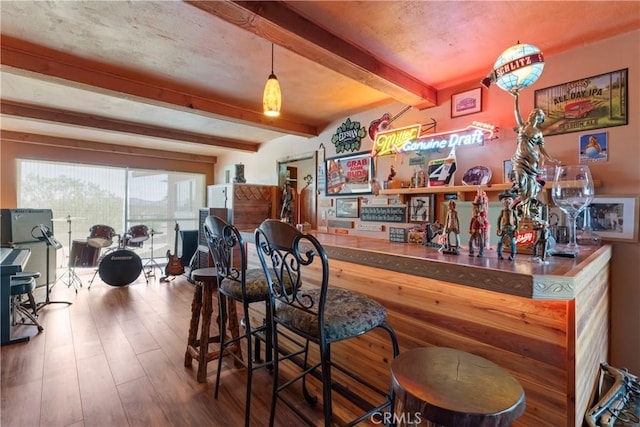 bar featuring hardwood / wood-style flooring and beam ceiling