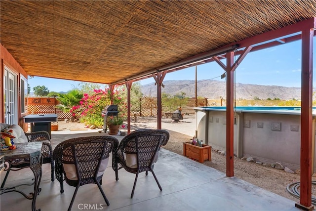 view of patio / terrace with a mountain view