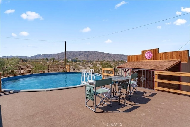 view of pool with a mountain view