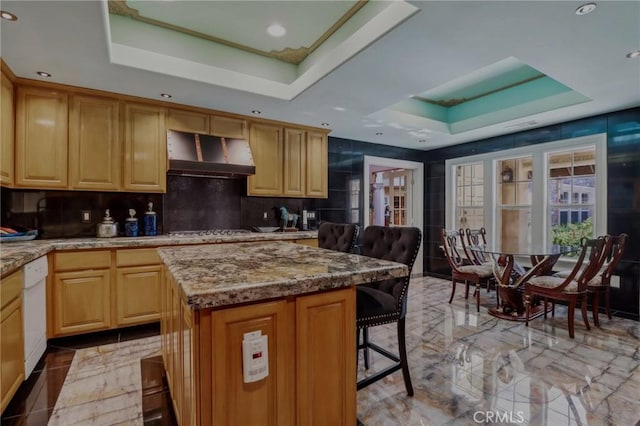 2611 Steeplechase Ln, Diamond Bar, CA 91765 - kitchen with a raised ceiling, exhaust hood, a breakfast bar, recessed lighting, and tasteful backsplash