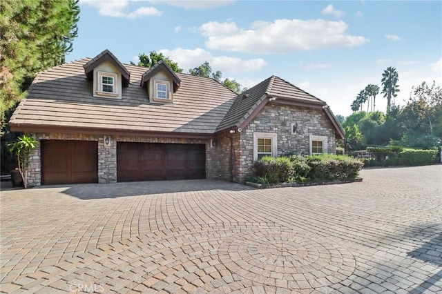 2611 Steeplechase Ln, Diamond Bar, CA 91765 - view of front of property featuring stone siding, a garage, and driveway