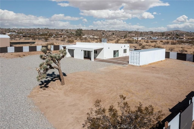 exterior space featuring stucco siding