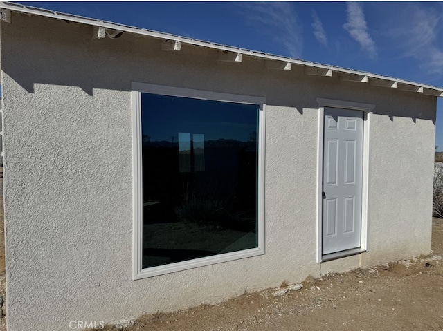 exterior space with stucco siding