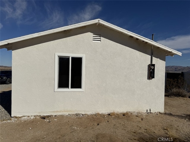 view of property exterior with stucco siding