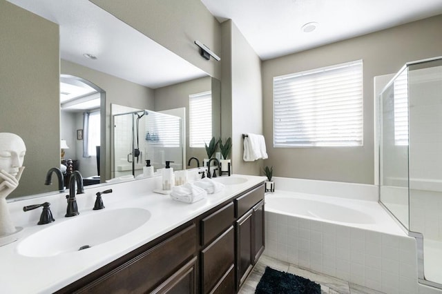 bathroom featuring independent shower and bath and vanity