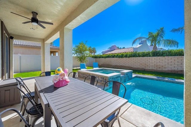 view of pool with ceiling fan, an in ground hot tub, and a patio area