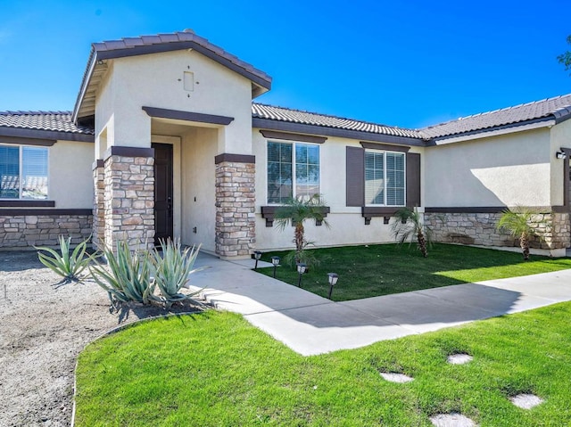 view of front facade with a front yard