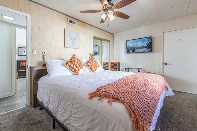 bedroom featuring a closet, carpet, and ceiling fan