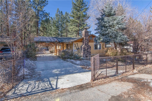 view of front of property featuring a carport