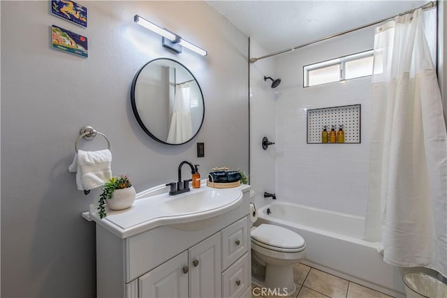 full bath featuring toilet, vanity, tile patterned flooring, and shower / tub combo