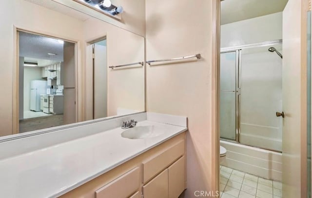 full bathroom with shower / bath combination with glass door, vanity, toilet, and tile patterned floors