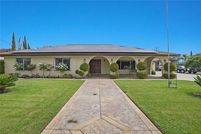 single story home featuring a front yard